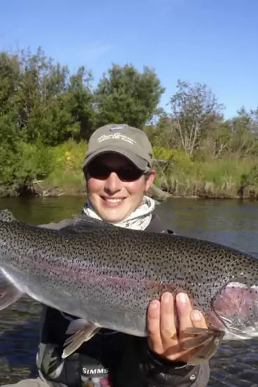 Large Copper River rainbow trout held by an angler